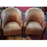 A pair of 20th century oak framed club chairs,