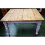 A 20th century dining table, the top formed from an arrangement of pine planks,