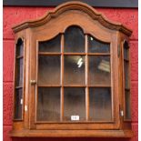 A 20th century oak wall hanging display cabinet,
