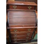 An early 20th century mahogany bureau, moulded top above a long drawer,