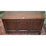 An 18th century oak blanket chest, moulded top above a three panel front, 123cm wide, c.