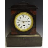 A 19th century belge noir mantel clock,