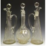 Three cut glass decanters,