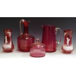 Two Mary Gregory cranberry glass vases; a cranberry glass ewer,