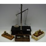 A set of W & T Avery apothecary scales mounted on armour plate cover base,