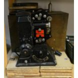 An early 20th century Pathescope projector, fitted case; a collection of news reels,