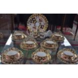 A Royal Crown Derby 2451 pattern part tea service, for seven, comprising boat shaped teapot,