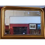 A 'gilt' framed wall mirror, rounded top, beaded border, bevelled plate, 109.