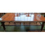 A Victorian mahogany rounded rectangular extending dining table, turned and fluted legs,