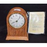 A Knight and Gibbins, London, mantel clock, golden oak and burr wood, eight-day movement,