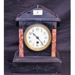 A French black slate mantel clock, Arabic numerals, key and pendulum, c.