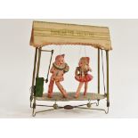 A Marionette Theatre, mechanical, with celluloid figures, tin theatre, clockwork, made in Japan, c.