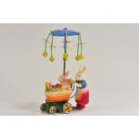 A Rosenthal celluloid clockwork bunny pushing baby in pram,