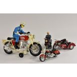 A Japanese Honda motorcycle, with rider, who does wheelies, battery operated, plastic,