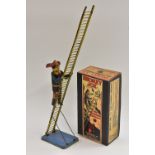 A Louis Marx & Co tin plate, wind-up, Smokey Joe, The Fireman Climbing Ladder, reproduction box,