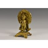 A 19th century gilt bronze novelty, of a Manneken Pis, he stands, in military dress,