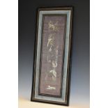 A 19th century Chinese silk sleeve panel, embroidered in coloured threads with exotic birds,
