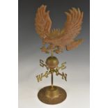 A copper and brass table top weathervane, eagle cresting, circular base, 42.