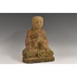 A Chinese softwood figure, carved as Buddha, seated, in contemplation, 24.