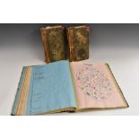 Heraldry - a 19th century Crest Album, enclosing clipped crests, coats of arms, monograms,