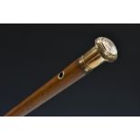 A 19th century gold coloured metal mounted malacca gentleman's walking cane,