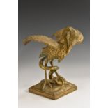 A 19th century gilt metal model, of a heron and snake, the serpent held underfoot, square base,