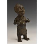 Tribal Art - a Benin bronze female figure, she stands, 29.