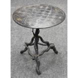 A 19th century painted slate circular table top, marked out for chess,