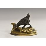 French School (19th century), a dark patinated and parcel-gilt cabinet bronze, of a hen, oval base,