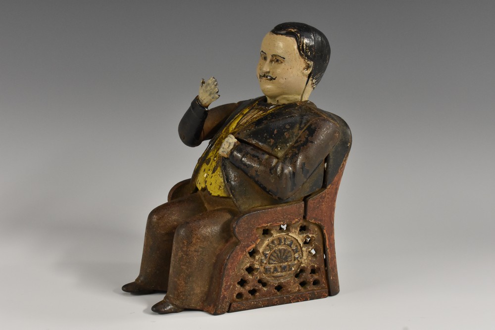 A 19th century American cast iron novelty patent mechanical money box, The Tammany Bank,