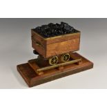 A brass mounted novelty box and cover on stand, as a laden coal wagon,