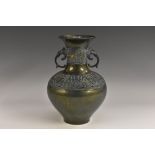 A Chinese verdigris lustre patinated bronze ovoid vase, cast with phoenix and bands of lappets,