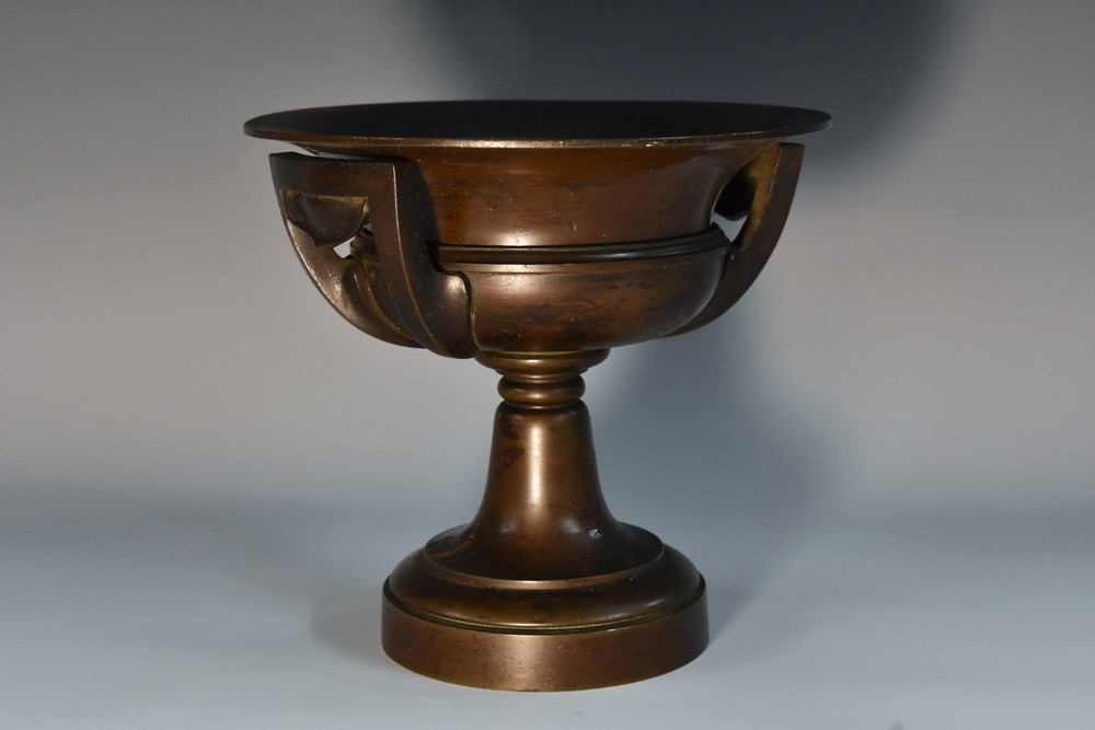 Grand Tour School (19th century), a dark patinated Grecian lip-cup, flared lip, squared handles,