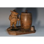 A Black Forest novelty tobacco jar, carved as a bearded gnome beside a barrel,