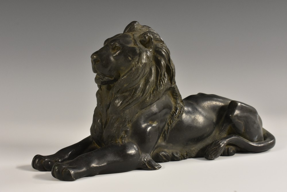 French School (19th century), a dark patinated library sculpture, of a recumbent lion,