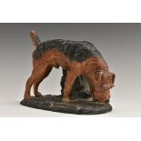 An Austrian cold painted spelter novelty table lighter, as a black and tan terrier, 17cm wide, c.