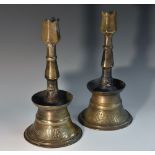 An Ottoman brass tulip candlestick, hexagonal baluster pillar,