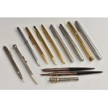 Pens - a silver propelling pencil,