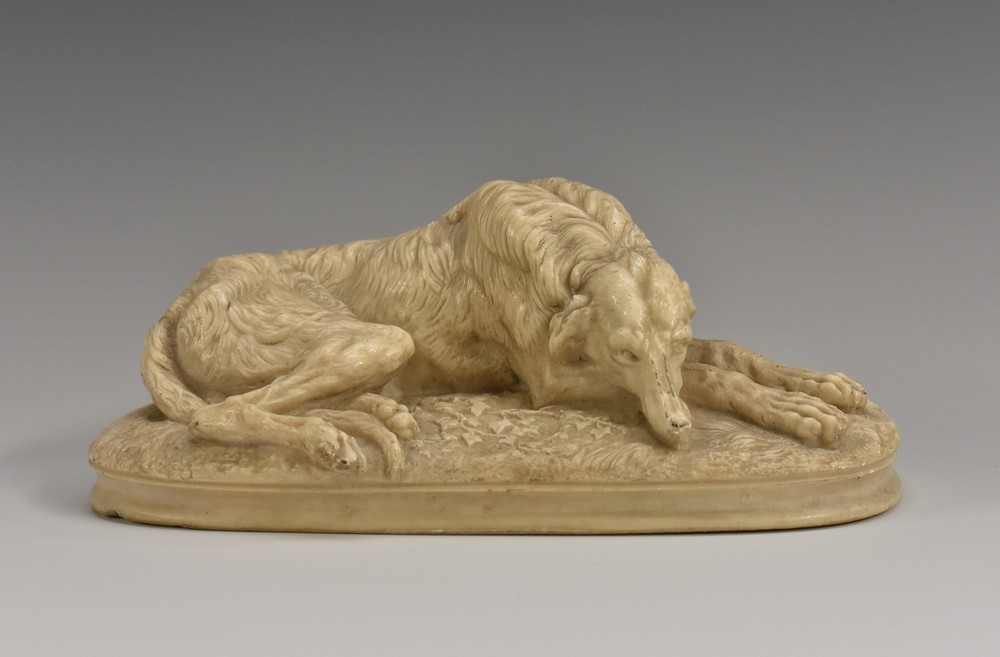 Continental School (19th century), a stone composition animalier model, of a dog, oval base, 15.