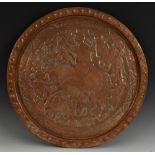 An Islamic copper charger, embossed with huntsman birds and foliage,