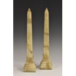 A pair of onyx library obelisks, stepped square bases, 37.