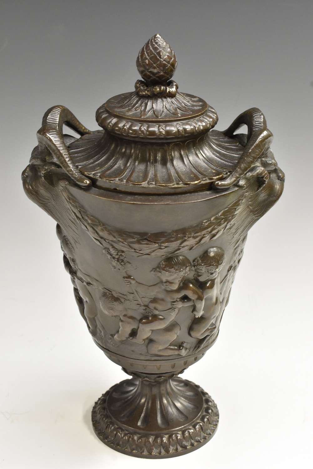 A 19th century French brown patinated bronze mantel urn and cover,