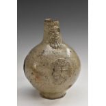 A 17th century fragmentary salt-glazed stoneware Bellarmine armorial jug,