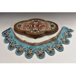 A Victorian mahogany and beadwork shaped oval table plateau, 48cm long, c.