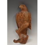 An early 20th century Japanese carved pine novelty coat hook, as an eagle perched on a branch,