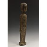 Tribal Art - a Dayak hampatong guardian figure, of typical elongated form, 'Moai' features,