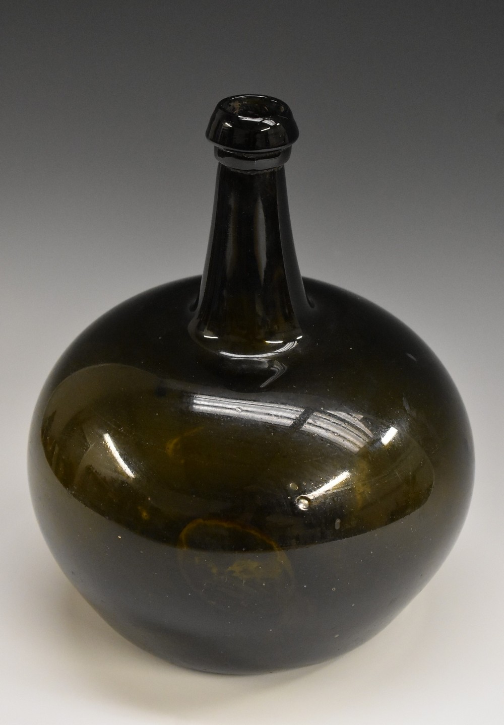 A large late 18th/early 19th century Dutch free blown onion wine bottle, 27cm high, c.