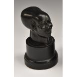 A Museum type composition model, of a head, after the Ancient Egyptian, ebonised base, 15.
