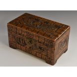 A Chinese camphor wood box, carved in relief with landscapes and blossoming prunus, bracket feet,