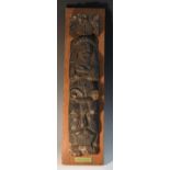 A Tudor oak figural pilaster, carved as a half-herm, a grotesque mask beneath him, 50cm long,